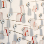 Silent languages, Chapter 4: Family history, installation MusVerre, Sars-Poteries, detail, pâte de verre, stainless steel, magnets, 2021-2022 (photo: Philippe Robin)