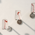 Silent languages, Chapter 4: Family history, installation MusVerre, Sars-Poteries, detail, pâte de verre, stainless steel, magnets, 2021-2022 (photo: Philippe Robin)