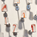 Silent languages, Chapter 4: Family history, installation MusVerre, Sars-Poteries, detail, pâte de verre, stainless steel, magnets, 2021-2022 (photo: Philippe Robin)